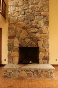 Chimney inspector examining a fireplace in a cozy living room