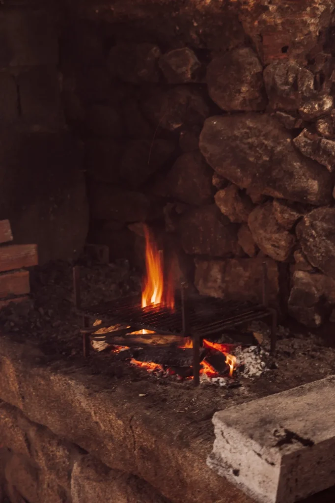 Professional installing a gas fire pit, illustrating installation complexity and safety