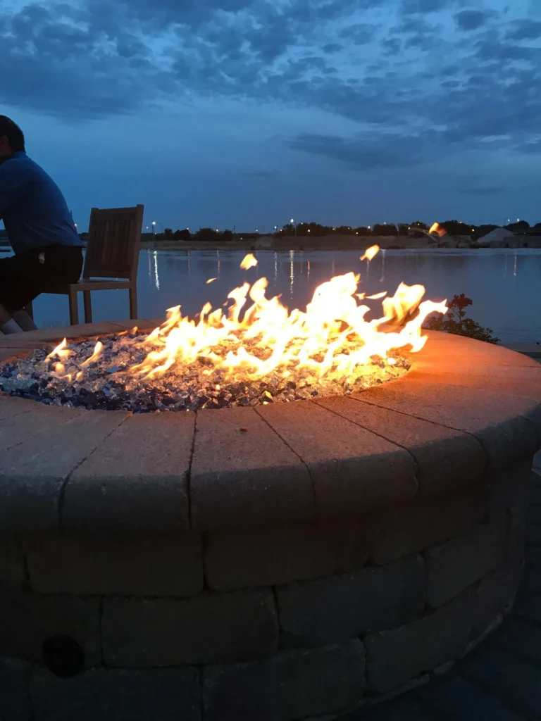 Variety of gas fire pit designs with integrated seating and landscaping