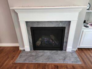 Professional gas fireplace installation with white mantel in Cincinnati home