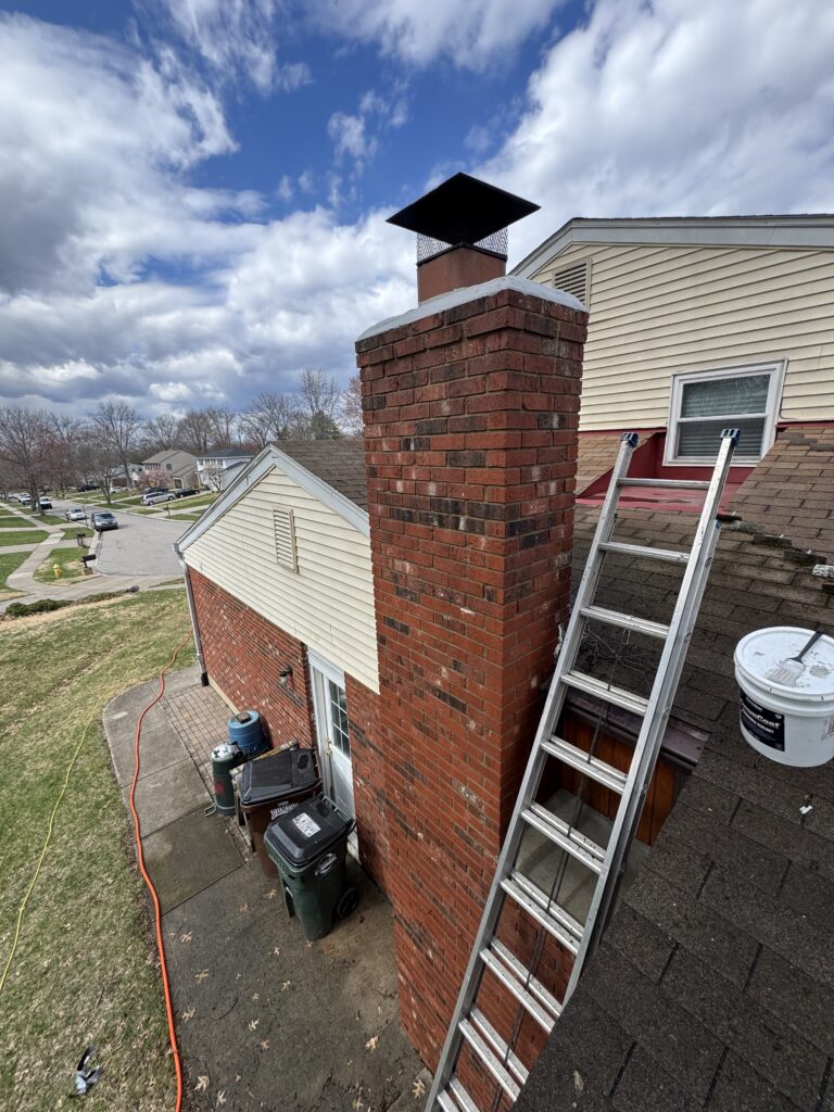 Close-up of chimney crown showing wear during cleaning inspection