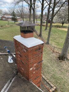Brick chimney exterior on Cincinnati home roof ready for cleaning